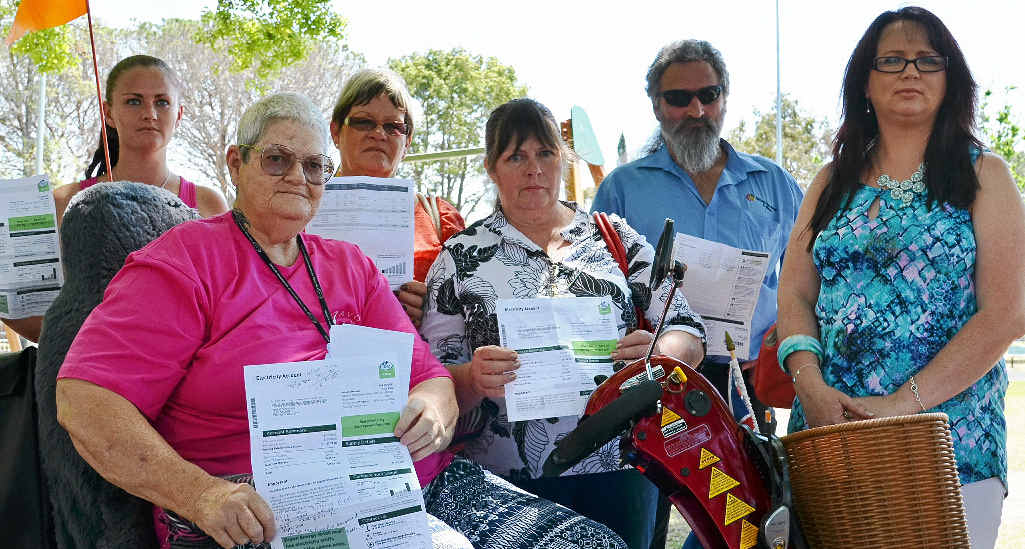 SHOCK: Angry Southern Downs bill payers Shanelle Thompson, Geane Brown, Nanette Sandy, Debbie De Hamer, Mick Murdoch and Laurel Hughes were among a large crowd of fuming residents who gathered in Leslie Park yesterday to compare their astronomically high electricity bills.